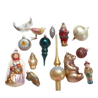 Artisan glassblower shaping a Christmas ornament